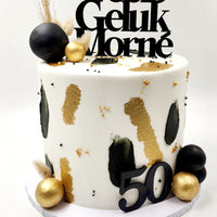 Elegant black and gold tall cake